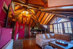 a living room with a couch and a table at Luxury Villa Medusa Temple in Kruševo