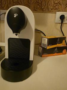 a black and white blender next to a box on a counter at COZY PANORAMA Flat in Alba Iulia