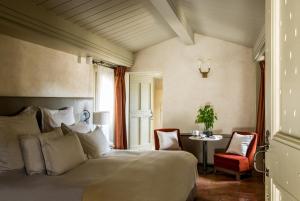 Postel nebo postele na pokoji v ubytování La Maison d'Uzès Relais & Châteaux