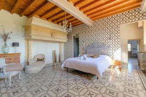 a bedroom with a bed and chairs in a room at La Vie de Château, proche Lyon in Bessenay +63 photos