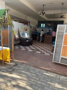 a room with a checkered floor and a counter at grand oceana resort in Covelong