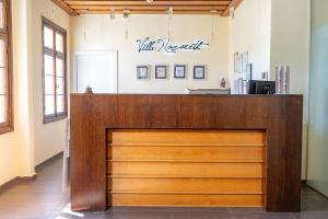 a wooden front door of a salon at Villa Nazareth - Boutique hotel in a central location in Nazareth