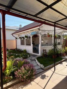 a porch of a house with a patio at Casa Alexander in Sulina