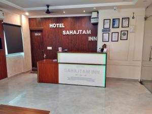 a hotel salahim inn with a reception desk in a lobby at Hotel Sahajtam Inn in Sonīpat