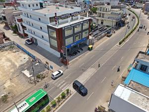 an overhead view of a city street with a building at Hotel Sahajtam Inn in Sonīpat