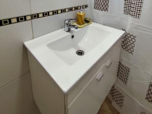a bathroom with a white sink in a room at Casa Nuup in Río Tercero +18 photos