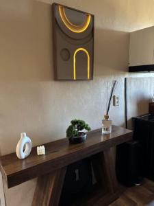 a wooden table in a kitchen with plants on it at L'escapade du temps in Les Épesses