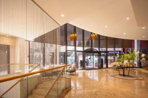 a lobby of a building with glass walls at Superb Beachfront Apartments with Shelter by Sea N' Rent in Tel Aviv