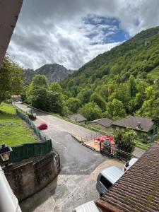 a view of a street with cars parked on the road at El Duje in Tielve