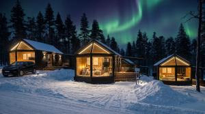 a cabin under the northern lights in the snow at Levi Nordic Star Igloos in Levi