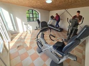 an overhead view of a gym with two men on bikes at Mara Ház in Lengyel