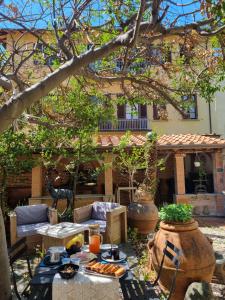 a table with food on it in a garden at B&B Firenze 400 in Florence