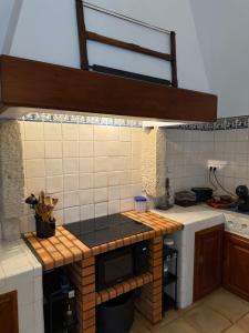 a kitchen with a counter top in a kitchen at Quinta do Passal in Coimbra