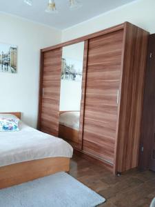 a bedroom with a large sliding glass door at Studio Szczawienko 2 in Wałbrzych