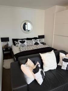 a living room with a couch and a bed at Executive Suite-Business Edition in Zurich