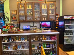 a bar with a lot of bottles of alcohol at Shree Muktinath Hotel in Pokhara