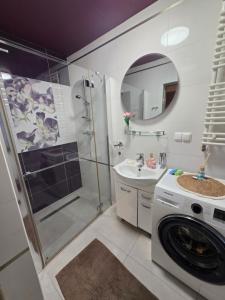 a bathroom with a shower and a washing machine at Chill House Lipowo Mazury in Lipowo +18 photos