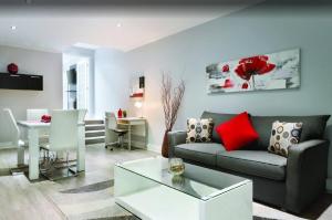 a living room with a couch and a table at Travelodge by Wyndham Quebec City Hotel & Convention Centre in Quebec City