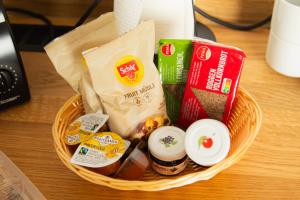 a basket filled with food on a table at Planet Blue Smartments in Sulzbach an der Murr +52 photos