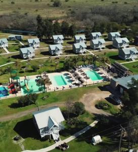an aerial view of a resort with a pool at Cabañas Portofino todo incluido in Ramallo +7 photos