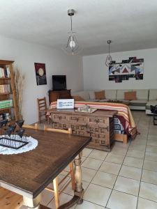 a living room with a couch and a table at La Grande Ferme in Arinthod