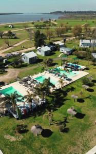 an aerial view of a resort with a pool at Cabañas Portofino todo incluido in Ramallo
