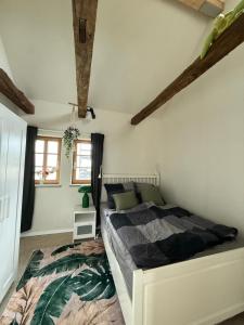 a bedroom with a large bed in a room at Fachwerk Anno 1789 in Lemgo