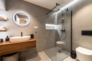 a bathroom with a sink and a shower at Penzion ZENIT in Prešov +39 photos
