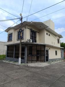 a building with a gate in front of it at Hotel Premier in Escuintla
