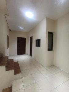 an empty room with white walls and a ceiling at Hotel Premier in Escuintla +1 photo