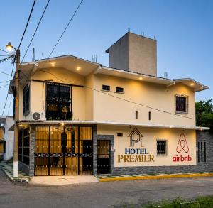 a building with a hotel penterer sign on it at Hotel Premier in Escuintla