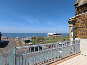 a view of the ocean from the balcony of a building at Bar 21 in Hunstanton