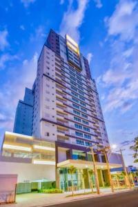 a tall building on the side of a street at Dna Smart Style in Goiânia
