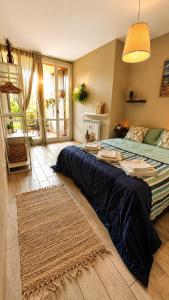 a bedroom with a large bed and a rug at Aloha Pool Apartment - Free Parking - Sirmione in Desenzano del Garda