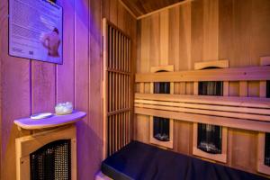 a inside of a sauna with a bench in a room at BioKompas SPA Apartment in Wrocław