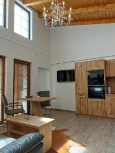 a living room with a couch and a table at Village Romantic Apartments by Český Krumlov Adults Only in Střížov