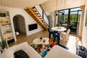 a living room with a couch and a table at Maisonette Wohnung WALDLOFT in Mehlmeisel