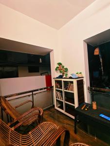 a room with a desk and a chair and a table at Phoenix Villa in Kappil