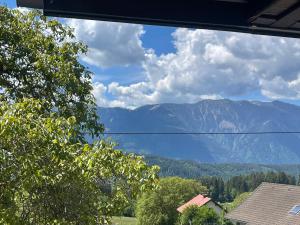 a view of the mountains from a house at Pension Victoria in Millstatt