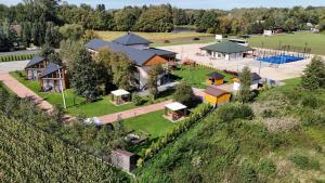 an aerial view of a house with a playground at HAPPY81 noclegi - 3,5km Energylandia in Zator