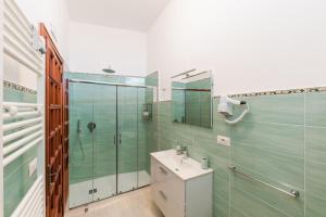 a bathroom with a sink and a shower and a toilet at Casa degli Ulivi in Ravello +40 photos