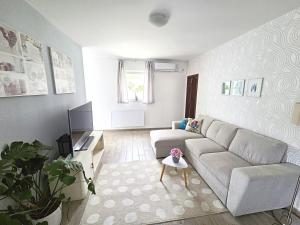 a living room with a couch and a table at Adriatic Pearl Korcula in Korčula