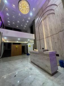 a lobby with a reception desk in a building at Hotel Brijraj Dham in Govardhan