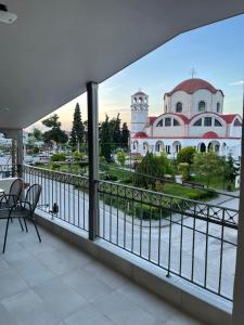a balcony with a view of a building at theaSee Sea & Mountain View in Nea Irakleia