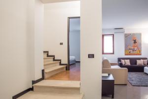 Letto o letti in una camera di Filodrammatici Loft by Welc(H)ome