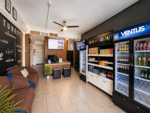 a grocery store with a drink counter and a pharmacy at Ica Adventures II in Ica