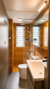 a bathroom with a sink and a toilet and a shower at Local Homestay in Hanoi +32 photos