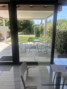 a patio with a table and chairs and a table and chairs at LUXURY vertical open space in Sangiano