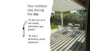 a picture of a patio with a table and chairs at LUXURY vertical open space in Sangiano