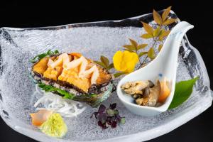 a plate of food with a sandwich and a spoon at 鵜原館 -Ubarakan- in Katsuura